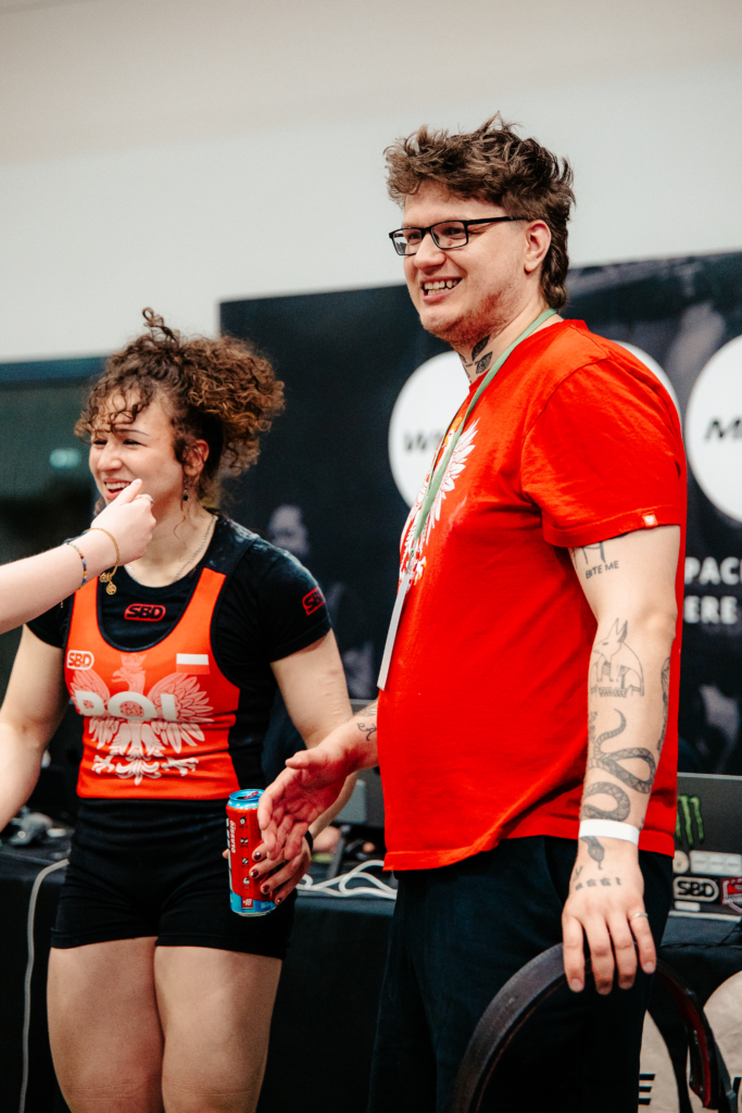 Matouš supporting an athlete at a competition